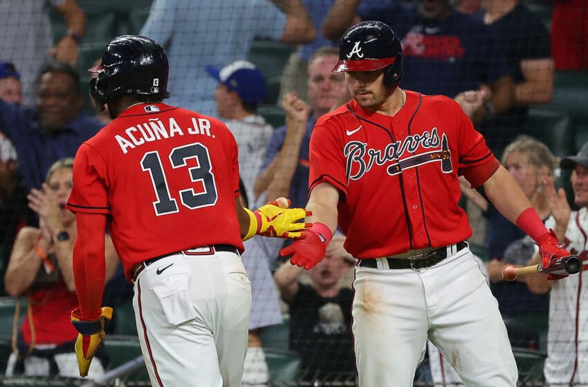 ATLANTA, GEORGIA - AUGUST 19: Ronald Acuna Jr. #13 of the Atlanta Braves celebrates with Austin Riley #27 after scoring on a two-run double by Dansby Swanson #7 in the sixth inning against the Houston Astros at Truist Park on August 19, 2022 in Atlanta, Georgia. (Photo by Kevin C. Cox/Getty Images)