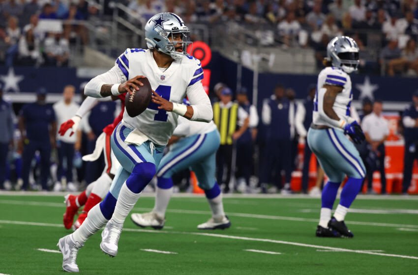 ARLINGTON, TEXAS - SEPTEMBER 11: Dak Prescott #4 of the Dallas Cowboys carries the ball against the Tampa Bay Buccaneers during the second half at AT&T Stadium on September 11, 2022 in Arlington, Texas. (Photo by Richard Rodriguez/Getty Images)