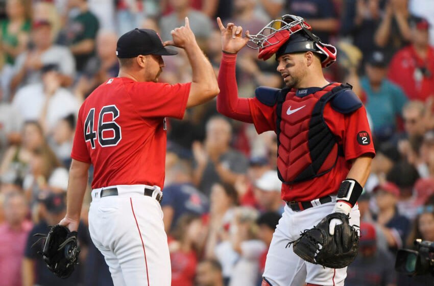 Aug 27, 2022; Boston, Massachusetts, USA; Boston Red Sox relief pitcher John Schreiber (46) celebrates with catcher Kevin Plawecki (25) after defeating the Tampa Bay Rays at Fenway Park. Mandatory Credit: Bob DeChiara-USA TODAY Sports