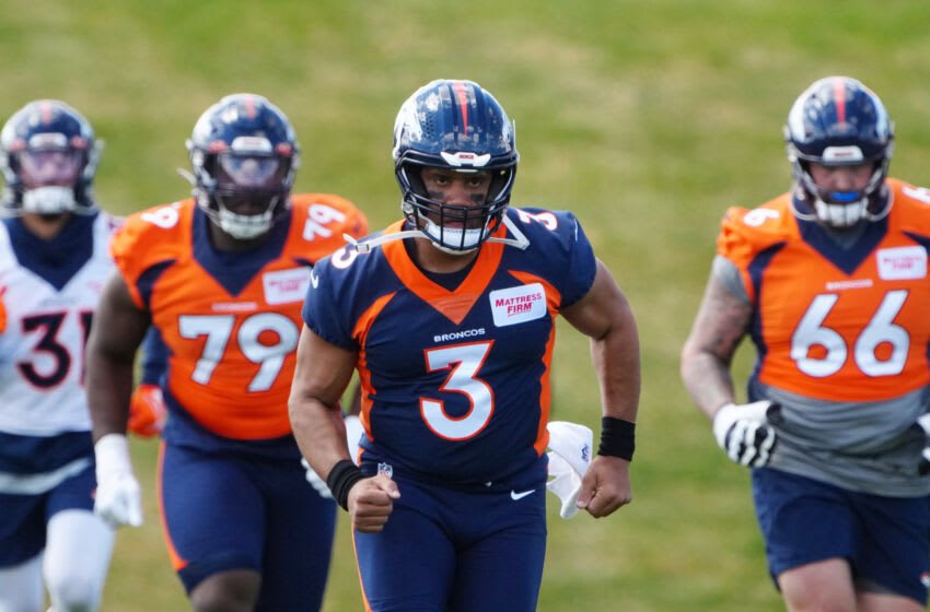 Apr 25, 2022; Englewood, CO, USA; Denver Broncos quarterback Russell Wilson (3) runs during a Denver Broncos mini camp at UCHealth Training Center. Mandatory Credit: Ron Chenoy-USA TODAY Sports