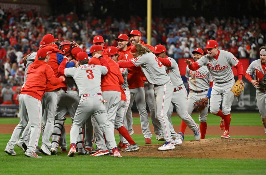 Oct 8, 2022; St. Louis, Missouri, USA; Members of the Philadelphia Phillies celebrate following their 2-0 victory against the St. Louis Cardinals in game two of the Wild Card series for the 2022 MLB Playoffs at Busch Stadium. Mandatory Credit: Jeff Curry-USA TODAY Sports