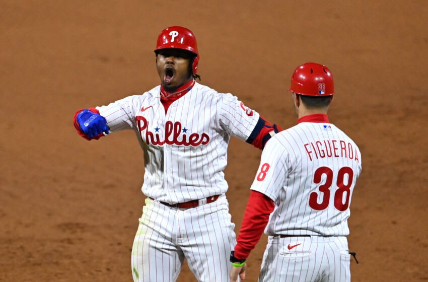 Oct 21, 2022; Philadelphia, Pennsylvania, USA; Philadelphia Phillies second baseman Jean Segura (2) reacts after hitting a two-run single in the fourth inning during game three of the NLCS against the San Diego Padres for the 2022 MLB Playoffs at Citizens Bank Park. Mandatory Credit: Kyle Ross-USA TODAY Sports