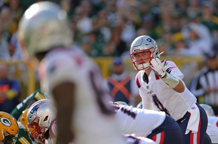 GREEN BAY, WISCONSIN - OCTOBER 02: Bailey Zappe #4 of the New England Patriots calls a play at the line of scrimmage during a game against the Green Bay Packers at Lambeau Field on October 02, 2022 in Green Bay, Wisconsin. The Packers defeated the Patriots 27-24 in overtime. (Photo by Stacy Revere/Getty Images)