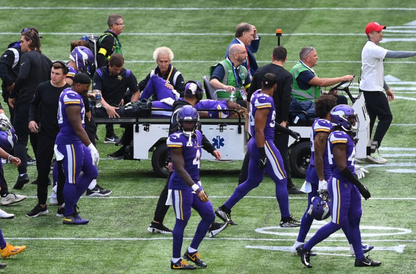 LONDON, ENGLAND - OCTOBER 02: Lewis Cine #6 of the Minnesota Vikings is stretchered from the field after an injury during the NFL match between Minnesota Vikings and New Orleans Saints at Tottenham Hotspur Stadium on October 02, 2022 in London, England. (Photo by Justin Setterfield/Getty Images)